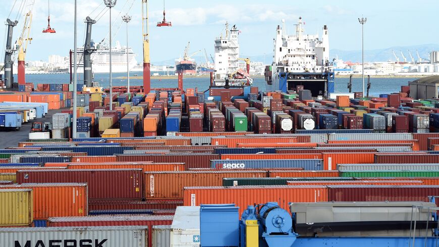 Cargo ships unload imported goods in the Tunisian port city of Rades on November 12, 2014. The World Bank said in a report published last September that Tunisia's economic model of manufacturing for exports and protecting the domestic market was valid in the 1970s but since then had hindered progress. AFP PHOTO / FETHI BELAID (Photo credit should read FETHI BELAID/AFP via Getty Images)