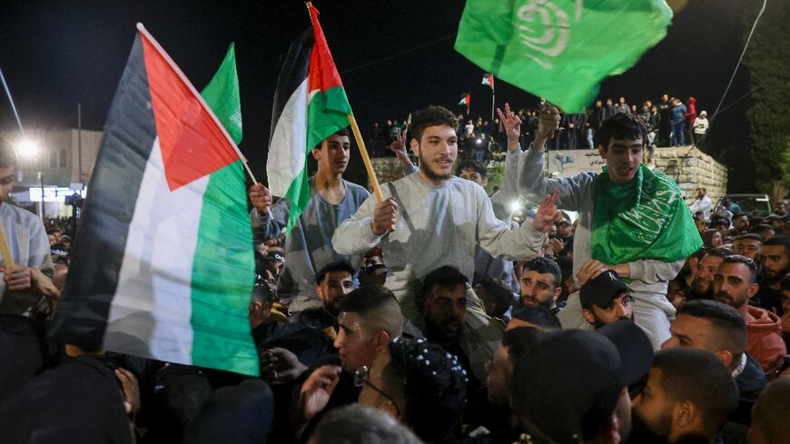 Crowds across the West Bank cheered and waved flags