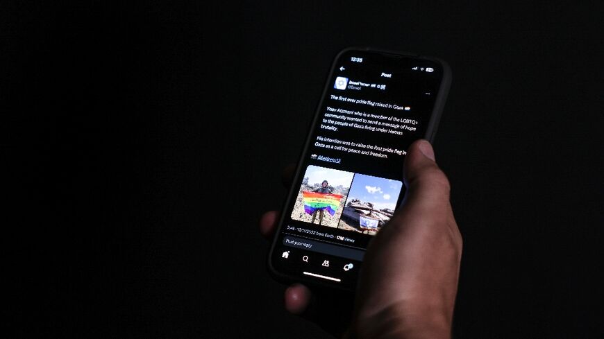 Amid the war ruins of Gaza, an Israeli soldier unfurls a rainbow flag in support of the LGBTQ community, in an image posted on social media