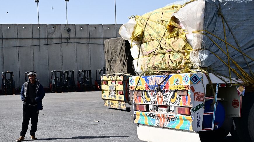 Egyptian drivers carrying aid to Gaza wait for hours at a recently reopened border crossing