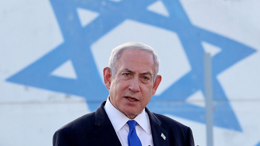 Israel's Prime Minister Benjamin Netanyahu delivers a speech during his visit to an Israeli unmanned aerial vehicle (UAV) centre, at the Palmachim Airbase near the city of Rishon LeZion on July 5, 2023. 