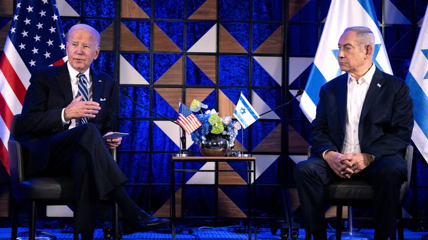 US President Joe Biden (L) listens to Israel's Prime Minister Benjamin Netanyahu as he joins a meeting of the Israeli war cabinet in Tel Aviv on Oct. 18, 2023.