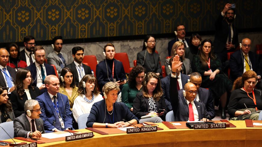 US Deputy Ambassador to the UN Robert Wood (2nd R) raises his hand during a United Nations Security Council after the vote about a ceasefire in Gaza at UN headquarters in New York on Dec. 8, 2023.