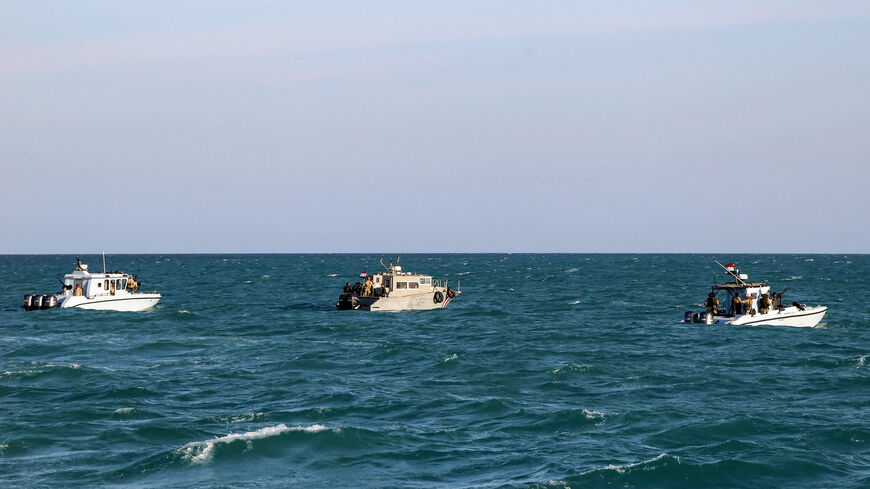 Yemeni coastguard members loyal to the internationally-recognised government ride in boats in the Red Sea off of the government-held town of Mokha in the western Taiz province, close to the strategic Bab al-Mandab Strait, on December 12, 2023. (Photo by Khaled Ziad / AFP) (Photo by KHALED ZIAD/AFP via Getty Images)