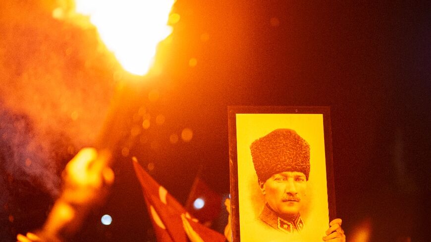 Fans of both teams welcomed the returning players, waving Turkish flags and pictures of Ataturk