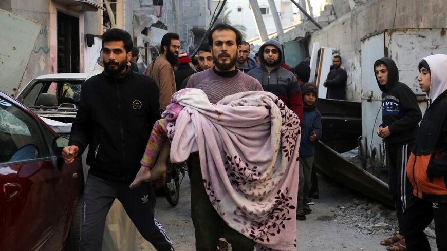 Palestinians were inspecting the damage on Saturday following an Israeli strike on the Zawayda area of the central Gaza Strip.