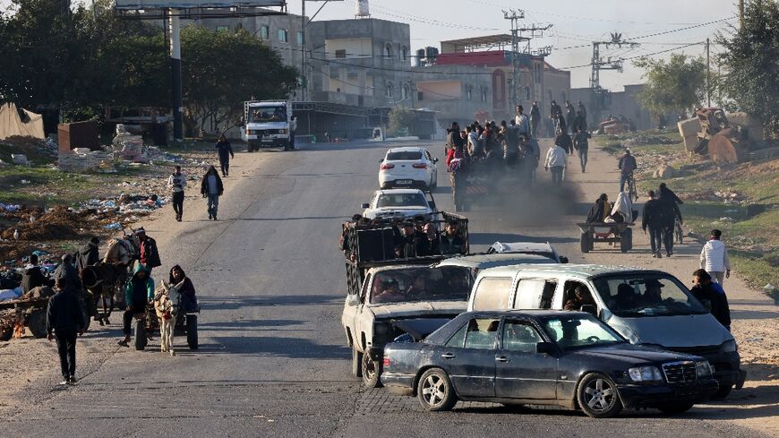 Palestinians flee Khan Yunis in southern Gaza Strip further south toward Rafah, near the Egyptian border