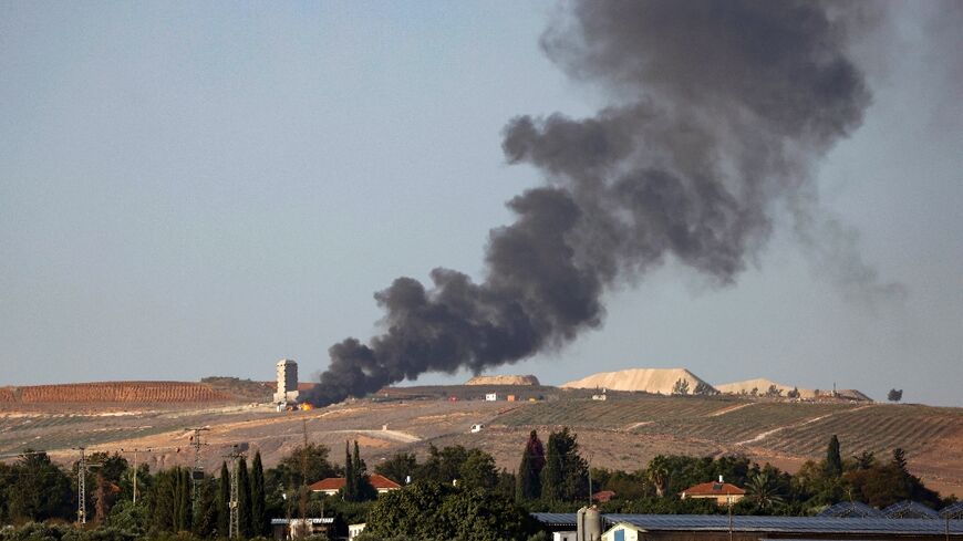 Flames and smoke rise over the Lebanese village of Khiam following Israeli bombardment