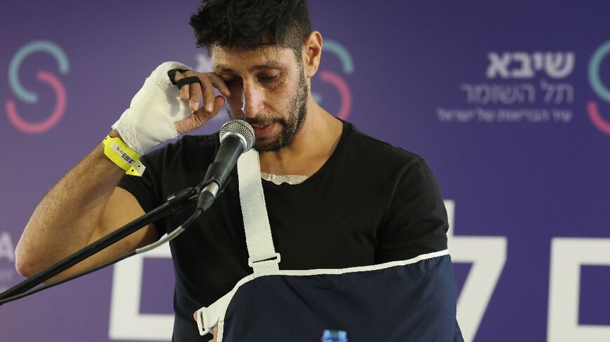 Fauda actor Idan Amedi addresses a press conference at a hospital near Tel Aviv