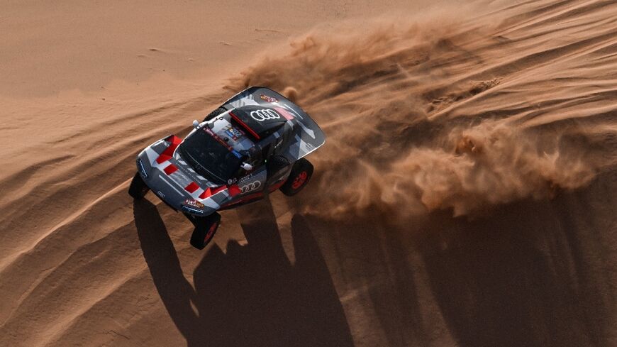 Sand man: Stephane Peterhansel en route to a record-equalling 50th Dakar stage win 