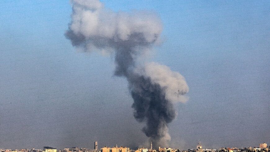 Smoke billows over Khan Yunis in the southern Gaza Strip during Israeli bombardment