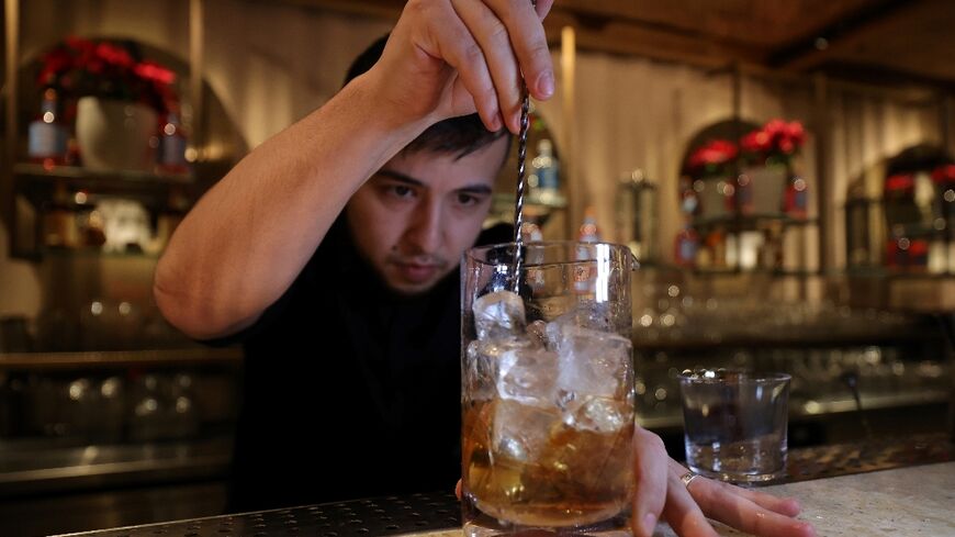 A bartender prepares a non-alcoholic cocktail in Riyadh