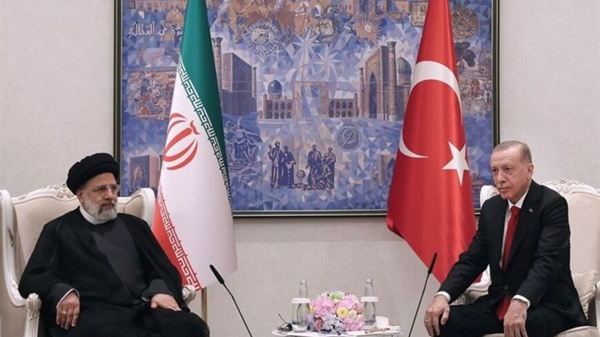 President Recep Tayyip Erdoğan shakes hands with Iranian President Ebrahim Raisi during a meeting in Samarkand, Uzbekistan, Sept. 17, 2022.
