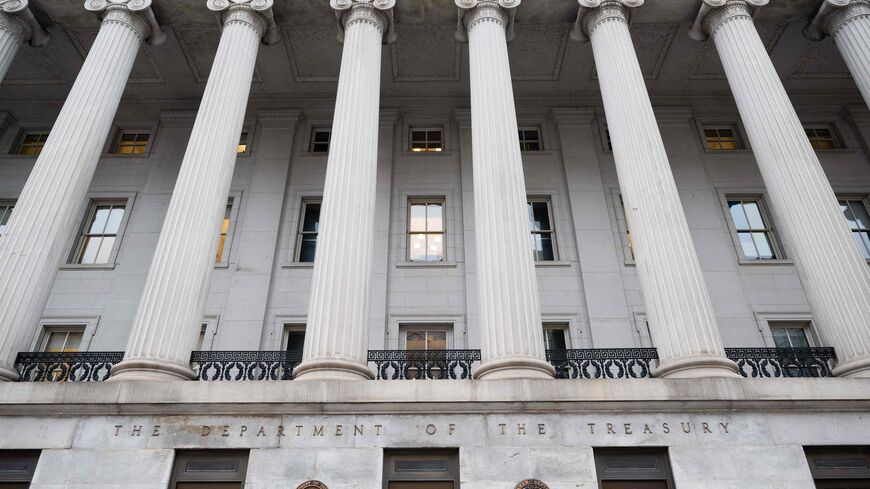 The US Treasury Department building is seen in Washington, DC, January 19, 2023, following an announcement by the US Treasury that it had begun taking measures Thursday to prevent a default on government debt, as Congress heads towards a high-stakes clash between Democrats and Republicans over raising the borrowing limit. - The world's biggest economy could face severe disruption with Republicans threatening to refuse the usual annual rubber stamping of a rise in the legal borrowing limit, and this could pu