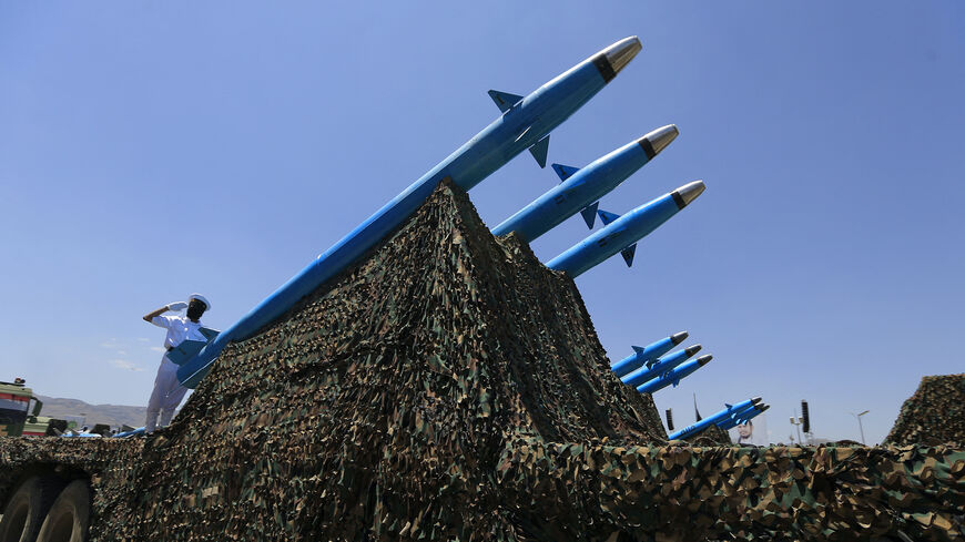 Huthi soldiers stand guard on a missile carrier during an official military parade marking the ninth anniversary of the Huthi takeover of the capital, Sanaa, on September 21, 2023. (Photo by MOHAMMED HUWAIS / AFP) (Photo by MOHAMMED HUWAIS/AFP via Getty Images)