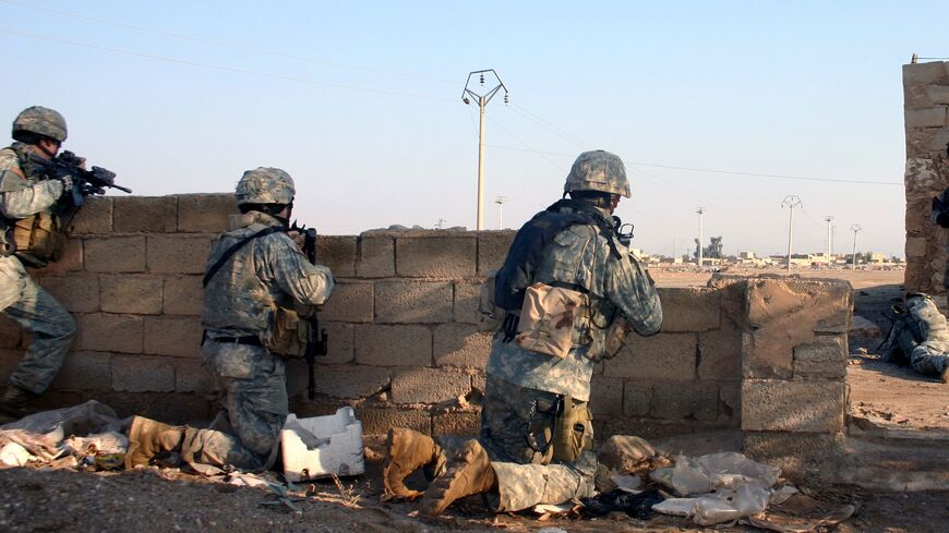 A group of US soldiers looks for an enemy that fired on their position.