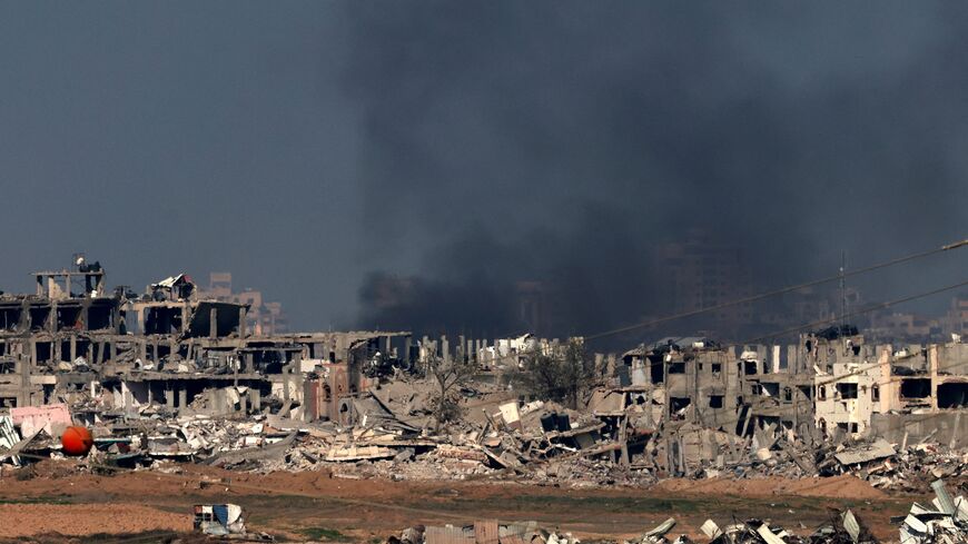 This picture taken from the Israeli border with the Gaza Strip shows smoke billowing over Gaza City following Israeli strikes on Jan. 1, 2024, amid the ongoing battles between Israel and the militant Hamas group.