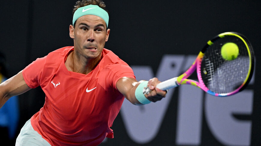 Spain's Rafael Nadal hits a return against Austria's Dominic Thiem during their men's singles match at the Brisbane International tennis tournament in Brisbane on January 2, 2024. (Photo by William WEST / AFP) / -- IMAGE RESTRICTED TO EDITORIAL USE - STRICTLY NO COMMERCIAL USE -- (Photo by WILLIAM WEST/AFP via Getty Images)