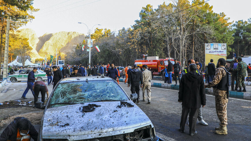 This picture shows people and Iranian emergency personnel at the site where two explosions in quick succession struck a crowd marking the anniversary of the 2020 killing of Guards general Qasem Soleimani, near the Saheb al-Zaman Mosque in the southern Iranian city of Kerman on Jan. 3, 2024.