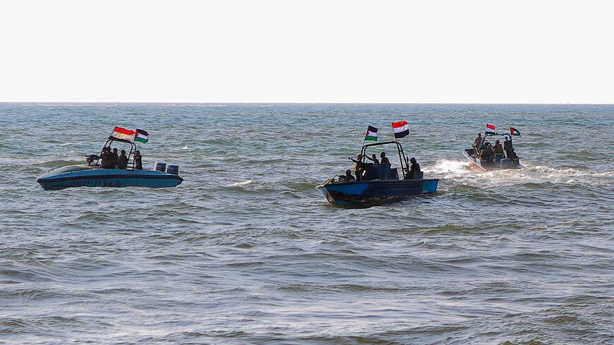 TOPSHOT - Members of the Yemeni Coast Guard affiliated with the Houthi group patrol the sea as demonstrators march through the Red Sea port city of Hodeida in solidarity with the people of Gaza on January 4, 2024, amid the ongoing battles between Israel and the militant Hamas group in Gaza. (Photo by AFP) (Photo by -/AFP via Getty Images)