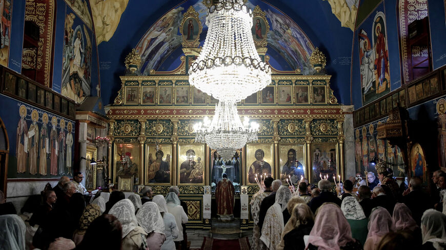 Orthodox worshippers attend a Christmas mass at the Greek Orthodox Church of Saint Porphyrius in Gaza City, Gaza Strip, Jan. 7, 2024.