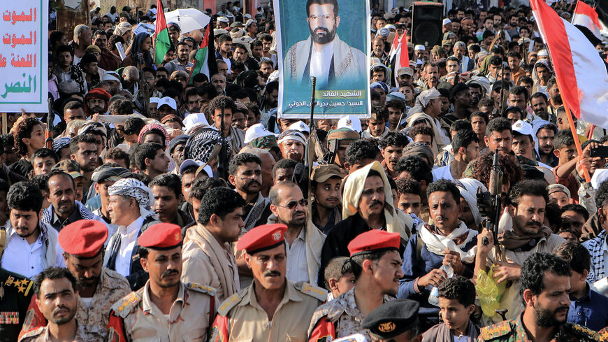 People take part in a protest in the streets of the Yemeni Red Sea city of Hudeida, to condemn the overnight US and British forces strikes on Houthi rebel-held cities, on Jan. 12, 2024, amid ongoing battles between Israel and the militant Hamas group in Gaza. 