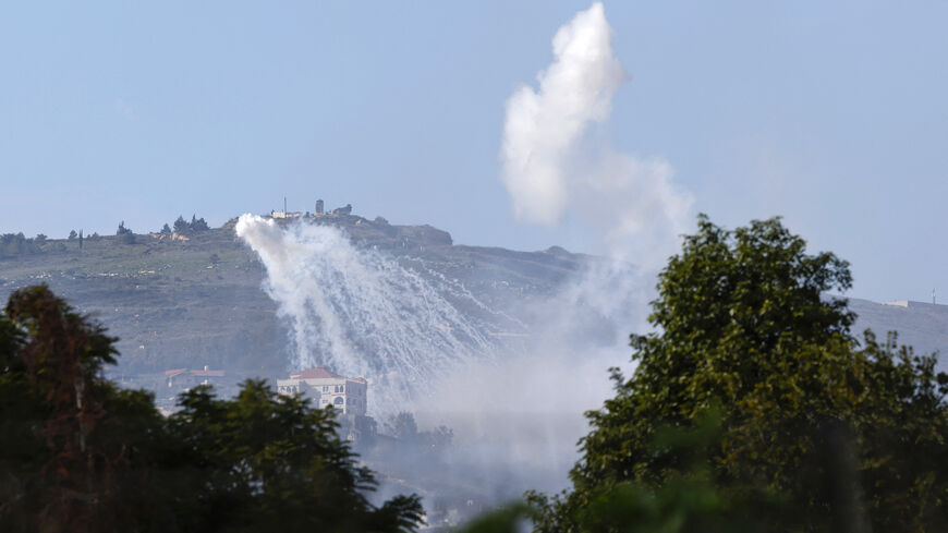 This picture taken from an Israeli position along the border with southern Lebanon shows smoke billowing above the Lebanese village of Adayseh during Israeli bombardment, Jan. 14, 2024.