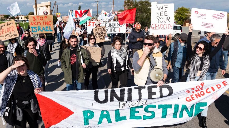 Peace protesters rally outside the Royal Air Force Akrotiri base near the Cypriot coastal city of Limassol