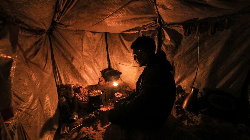 Firewood is scarce and expensive in Gaza, so those displaced by the fighting are forced to burn plastic waste for heat