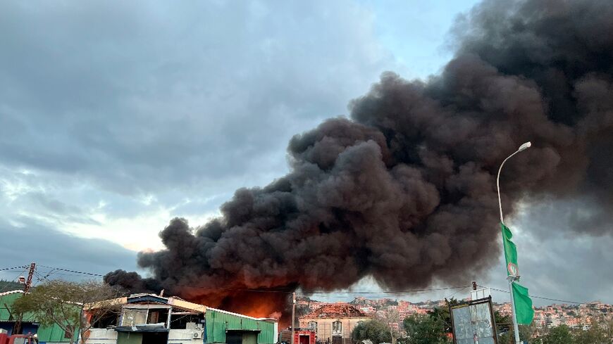 An AFP photographer reported the sound of at least two successive strikes in Ghaziyeh, one targeting a hangar close to the main coastal highway, with dark smoke billowing across the area