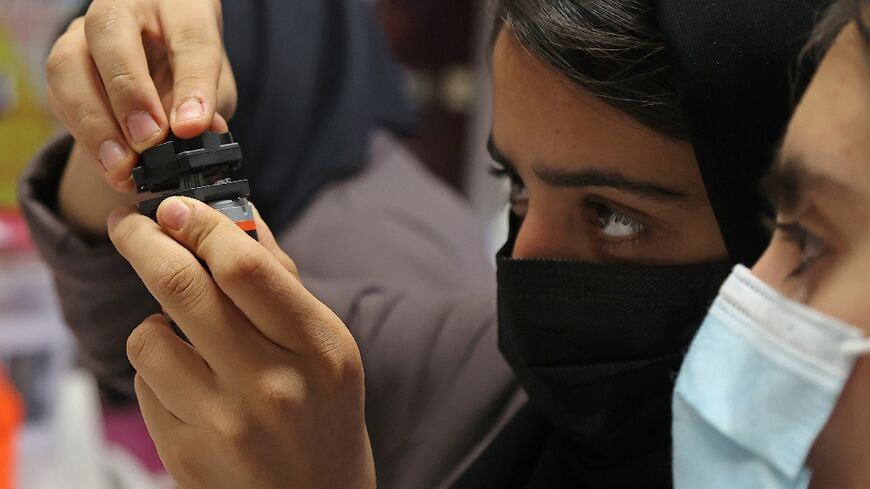 Members of an all-girl Afghan robotics team who fled the Taliban continue their studies in 2021 at the Qatar campus of Texas A&M, which the US university has announced will now close