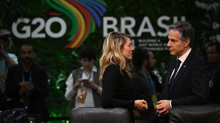 Canada's Minister of Foreign Affairs Melanie Joly (L) and US Secretary of State Anthony Blinken chat during the G20 foreign ministers meeting in Rio de Janeiro, Brazil, on February 21, 2024