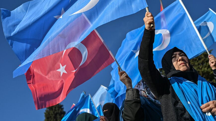 Supporters of China's Muslim Uighur minority wave flags of East Turkestan and Turkey during a demonstration at Beyazid Square, Istanbul, Dec. 14, 2019.