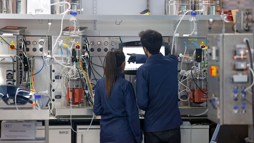 Technicians produce "cultured chicken" meat at the food-tech startup SuperMeat in the central Israeli town of Ness Ziona on June 18, 2021. - It looks like chicken and tastes like chicken; but diners in Israel are tucking into laboratory-grown "meat" that scientists claim is an environmentally-friendly way to feed the world's growing population. (Photo by JACK GUEZ / AFP) (Photo by JACK GUEZ/AFP via Getty Images)