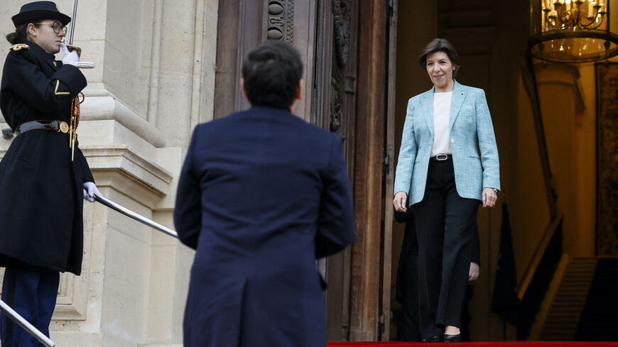Outgoing French Foreign Minister Catherine Colonna (R) welcomes newly appointed Foreign Minister Stephane Sejourne at the ministry before the handover ceremony in Paris, on Jan. 12, 2024.