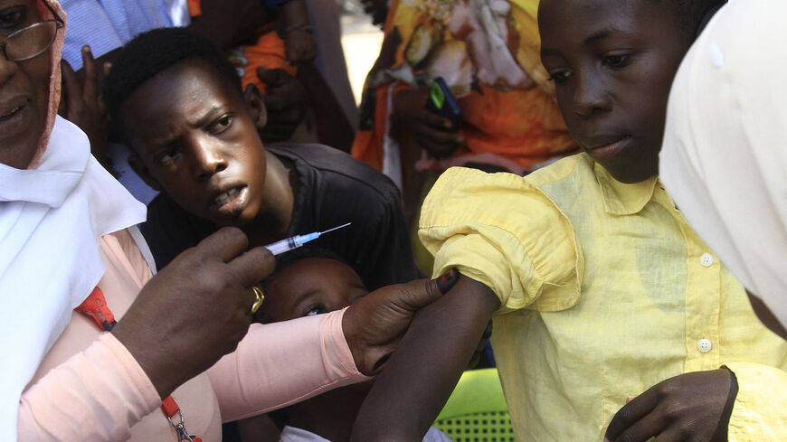 A young Sudanese receives a vaccine shot in Sudan's eastern state of Gedaref on January 22, 2024, during a vaccination campaign against the measles and rubella virus. (Photo by AFP) (Photo by -/AFP via Getty Images)