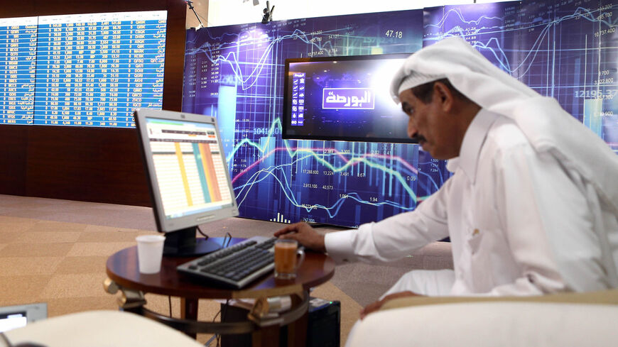 A trader prepares before the opening of the stock market at the stock exchange in Doha, Qatar, July 31, 2017.