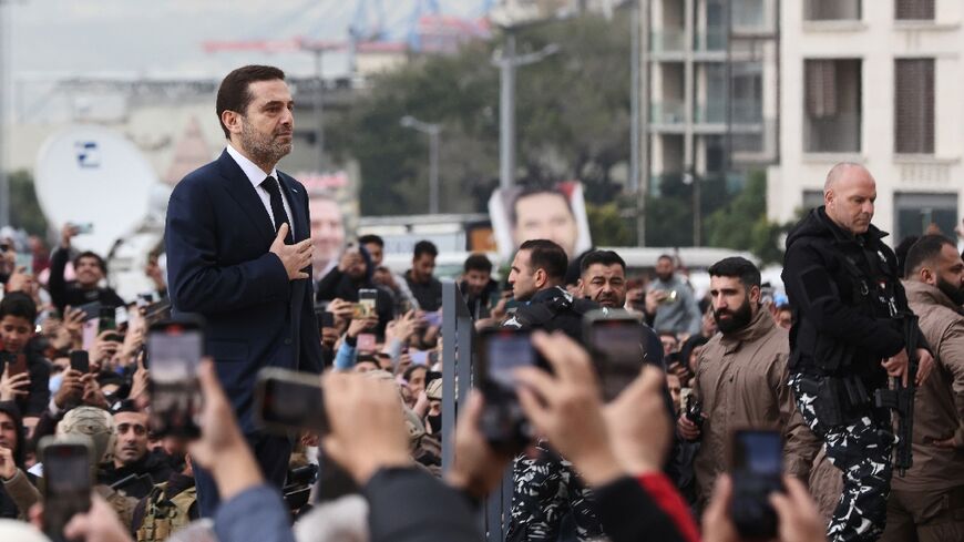 Former Lebanese prime minister Saad Hariri greets supporters after performing anniversary prayers at the grave of his father Rafic, assassinated in a 2005 truck bombing