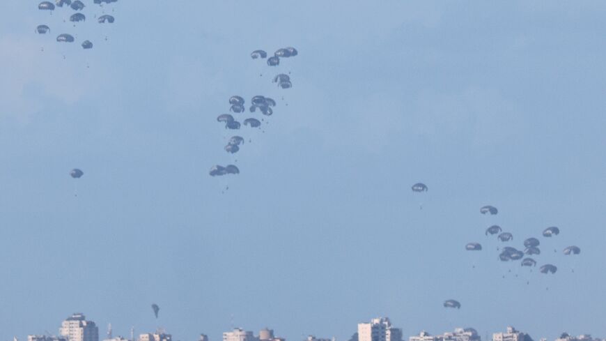 The pallets of humanitarian aid being airdropped into northern Gaza