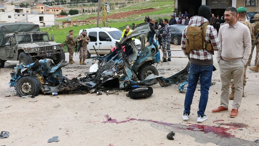 Lebanese soldiers cordon off the site of a strike in Suwairi, eastern Lebanon -- a security source blamed the strike on 'Israeli aircraft' and said the Syrian driver was killed