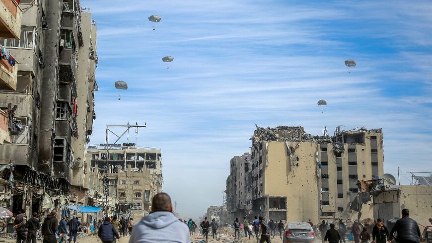 Foreign militaries have air dropped supplies over Gaza, sending a sea of humanitarian aid supplies floating down  