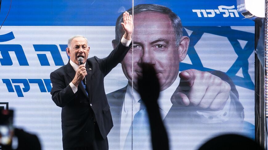 Former Israeli Prime Minister Benjamin Netanyahu speaks to supporters through inside a modified truck with a side bulletproof glass during a campaign event on Oct. 29, 2022 in Bnei Brak, Israel.