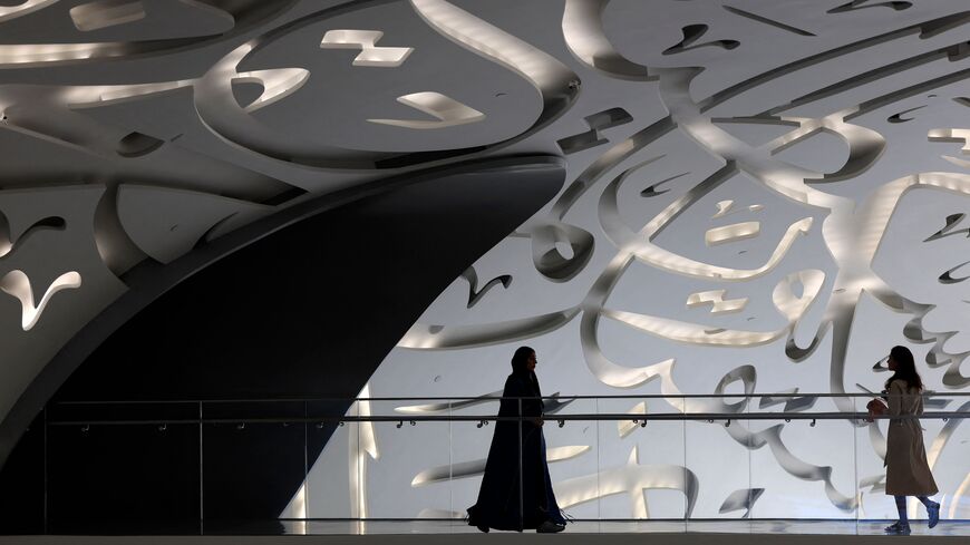 Women walks through the Museum of the Future in Dubai during the Artificial Intelligence Forum held on October 11, 2023. (Photo by Karim SAHIB / AFP) (Photo by KARIM SAHIB/AFP via Getty Images)