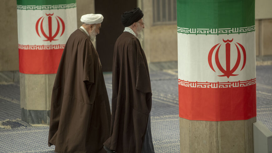 TEHRAN, IRAN - MARCH 01: Iran's supreme leader Ayatollah Ali Khamenei (R)leaves after casting his ballots during the parliamentary and key clerical body elections at a polling station on March 1, 2024 in Tehran, Iran. Iranians are voting in parliamentary elections and will also cast ballots for the Assembly of Experts, which selects and nominally oversees the work of Iran's supreme leader. (Photo by Majid Saeedi/Getty Images)