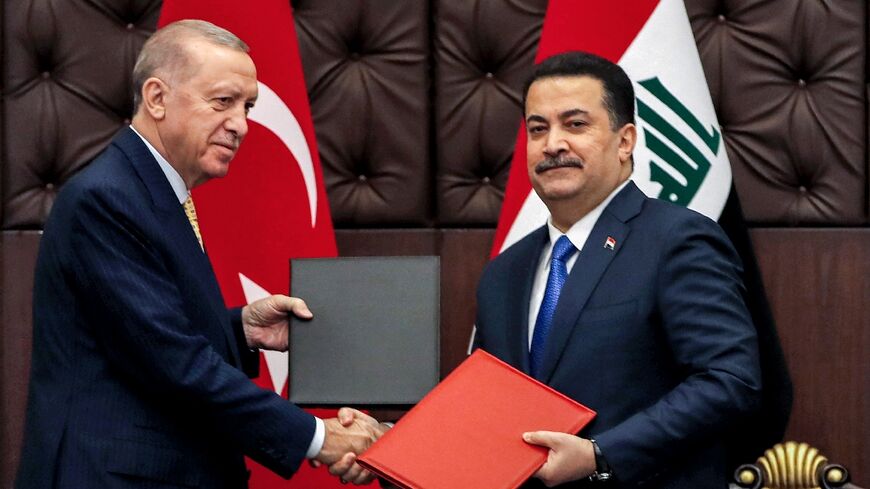 Turkey's President Recep Tayyip Erdogan and Iraq's Prime Minister Mohammed Shia al-Sudani exchange signed agreements