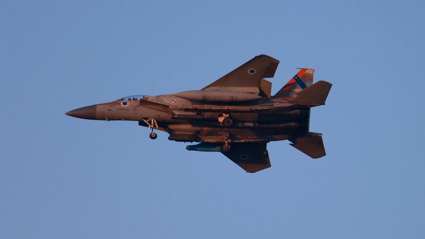 An Israeli army F-15 fighter jet flies over central Israel