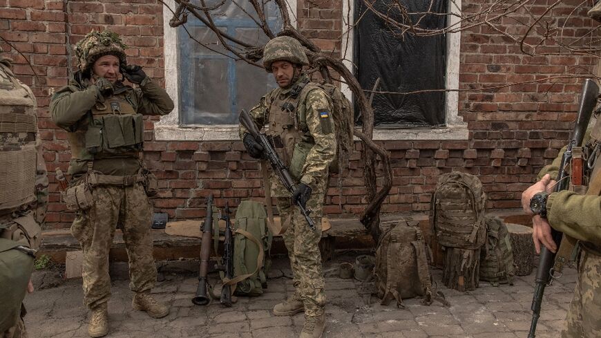 Ukrainian soldiers from the 23rd Mechanized Brigade prepare to head toward the frontline in the Donetsk region on April 3, 2024