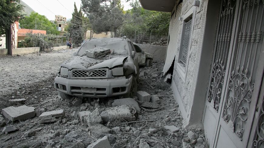 Rubble litters the area around a house hit by an Israeli air strike in the southern Lebanese village of Shebaa 