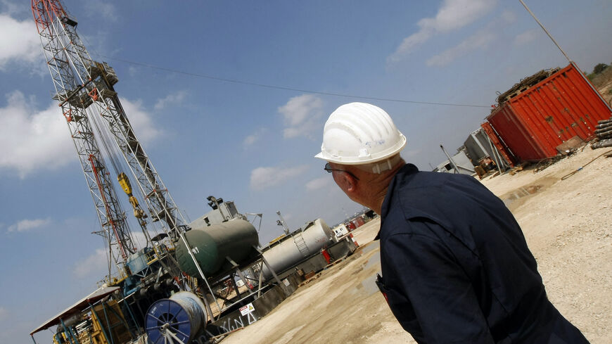 TO GO WITH AFP STORY BY PATRICK MOSER An Israeli employee works at Zion Oil and Gas company's oil-drilling platform in Isarel's onshore rig in Maanit, about 50 kms north of Tel Aviv, on July 29, 2009. Texan John Brown, who founded the company, says he is on a divine mission to find oil in the land of milk and honey. He is not the only one who has faith that there is oil under the Holy Land. Brown points out that his Zion Oil and Gas company, which is listed on the New York Stock Exchange, recently raised 21