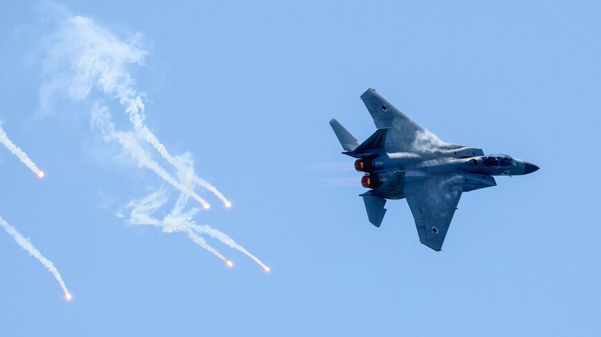 An F-15E Strike Eagle fighter aircraft of the Israeli Air Force Aerobatic team flies during a rehearsal for the upcoming Independence Day air show in Tel Aviv on April 24, 2023.